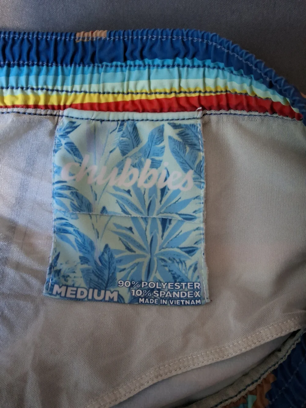 chubbies Navy Swim Trunks with Rainbow Stripes and Aztec Motif